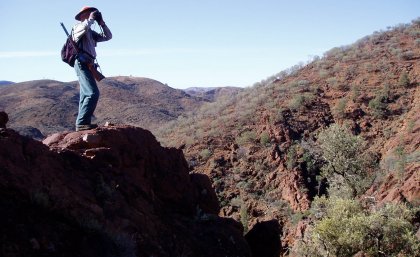 Photo of hunter in rugged Australian outback
